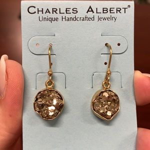 Pyrite dangle earrings set in Alchemia